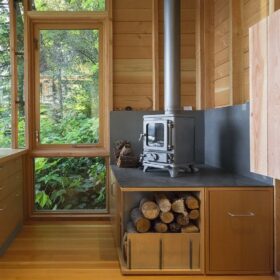 Hobbit small wood burning stove installed in a garden office - hotboxstoves.co.uk