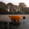 Dutchtub original orange on a lake deck - hotboxstoves.co.uk