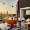 Dutchtub original orange on a patio - hotboxstoves.co.uk